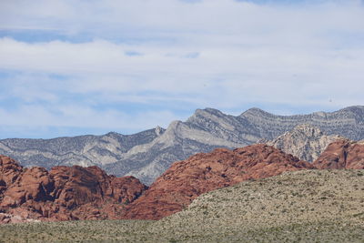 Scenic view of rocky mountains against sky