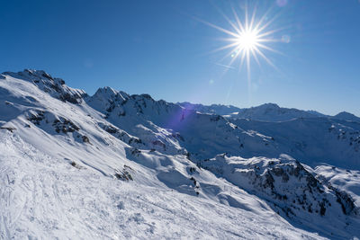 Scenic view of snowcapped mountains against sky