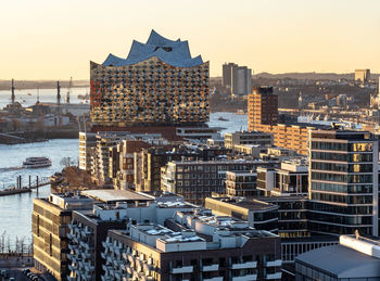 High angle view of buildings in city against clear sky