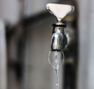 Close-up of water falling from faucet