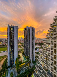 High angle view of buildings against sky during sunset