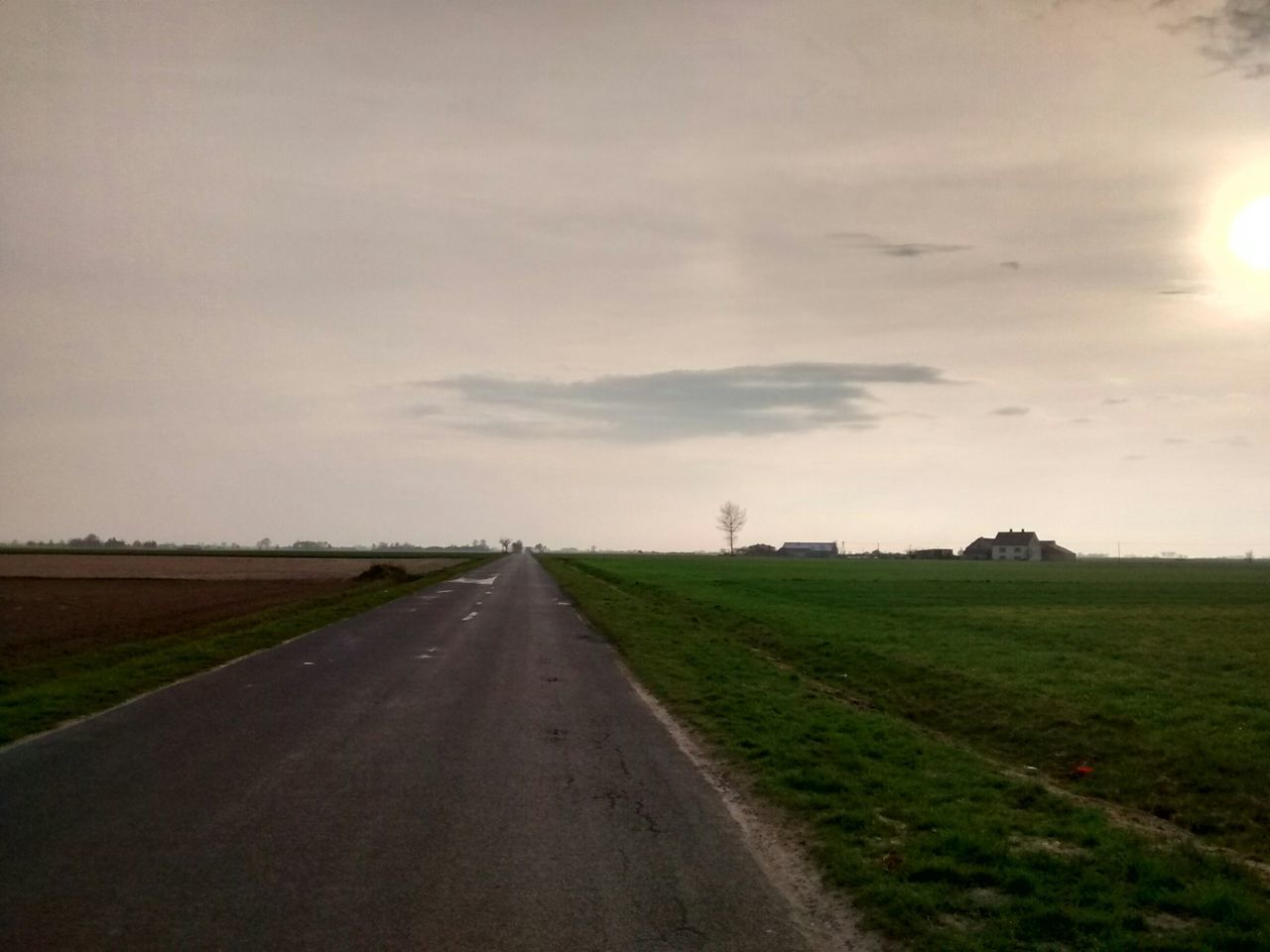 the way forward, diminishing perspective, road, vanishing point, transportation, sky, field, landscape, country road, grass, tranquility, tranquil scene, nature, empty road, rural scene, cloud - sky, scenics, beauty in nature, tree, long