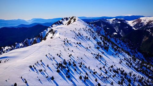 High angle view of snowcapped mountains against sky