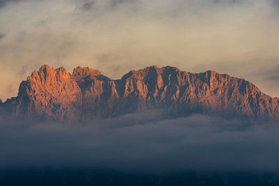 Scenic view of mountain against sky during sunset