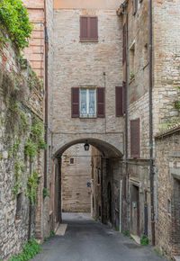 Alley amidst buildings in city