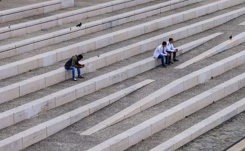 High angle view of people walking on staircase