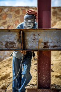 Welder working at construction site