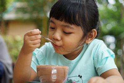 Portrait of asian girl sitting in cafe