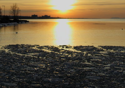 Scenic view of sunset over river