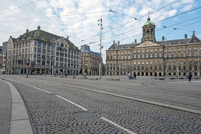 Damsquare in amsterdam the netherlands with the royal palace