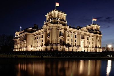 Reflection of building in water at night