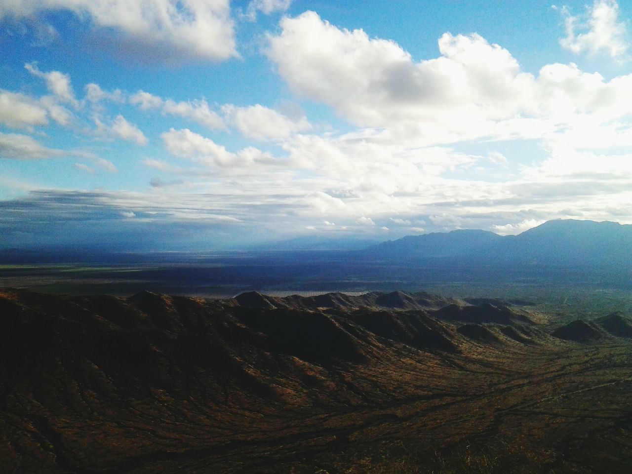 landscape, tranquil scene, tranquility, scenics, mountain, sky, beauty in nature, nature, mountain range, cloud - sky, cloud, non-urban scene, horizon over land, remote, idyllic, physical geography, cloudy, geology, barren, day