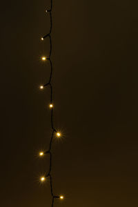Low angle view of illuminated street light against sky at night