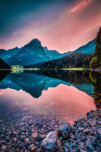 Scenic view of lake against sky during sunset