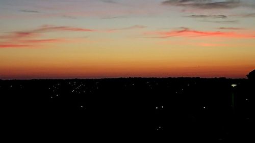 Scenic view of silhouette landscape against romantic sky at sunset