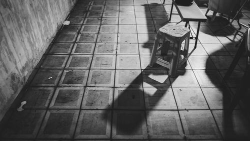 Low section of woman on tiled floor