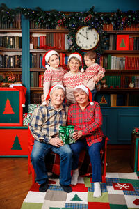 Cheerful grandparents and grandchildren are taking photo. family