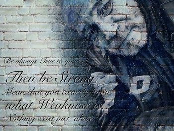 Close-up portrait of woman against wall