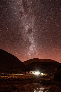 Scenic view of sea against sky at night