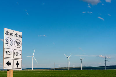 Alberta road signs, pointing to wind farms