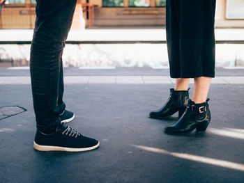 Low section of people standing on street