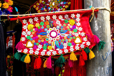 Close-up of clothes hanging in market for sale