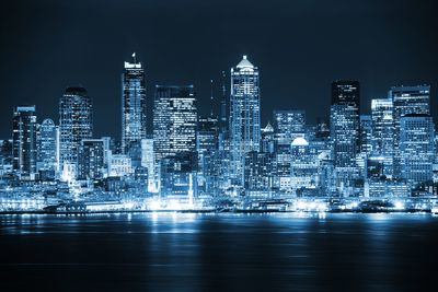 Illuminated buildings in city at night