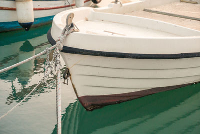 High angle view of fishing boat moored at harbor