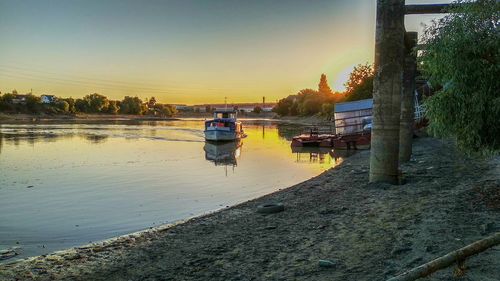Rear view of man on river against sky