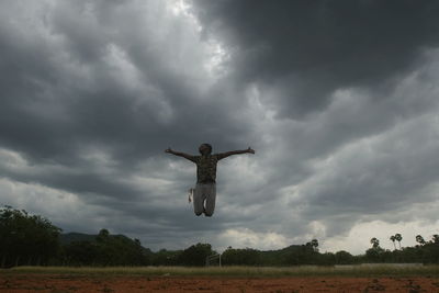 Bird flying over a field