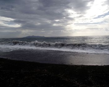 Scenic view of sea against cloudy sky