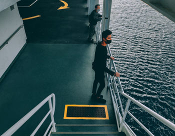 High angle view of man standing on staircase
