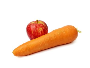 Close-up of orange slices over white background