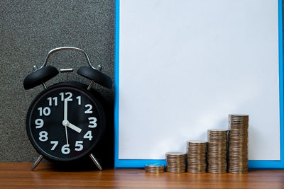 Close-up of clock on table