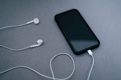 High angle view of smart phone on table