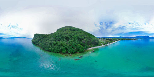 Panoramic view of bay against sky