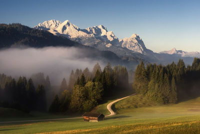 Scenic view of snowcapped mountains against sky