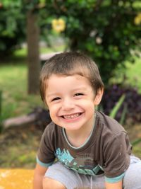 Portrait of smiling boy playing outdoors