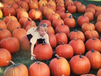 Full frame shot of pumpkins on field