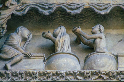 Sculpture of statues on wall of building