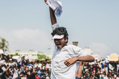 Man protesting during protest against sky