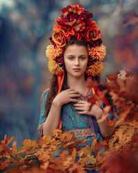 Portrait of girl wearing floral headdress