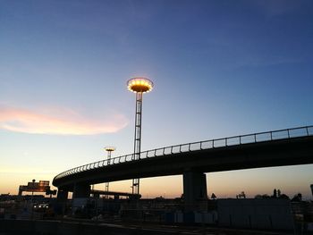Low angle view of bridge against sky during sunset