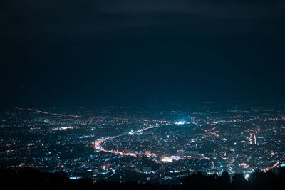 High angle view of illuminated buildings in city at night