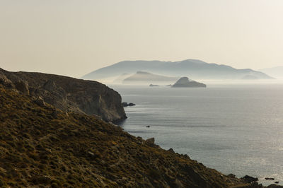 Scenic morning view of santorini from folegandros island  against clear sky