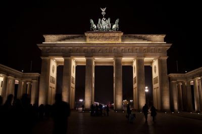 Low angle view of historical building at night