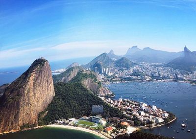 Panoramic shot of city by sea against sky