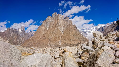 Low angle view of rock formations against sky