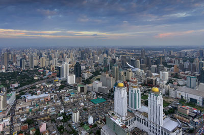 High angle view of modern buildings in city against sky