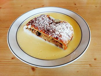 High angle view of cake slice in plate on table